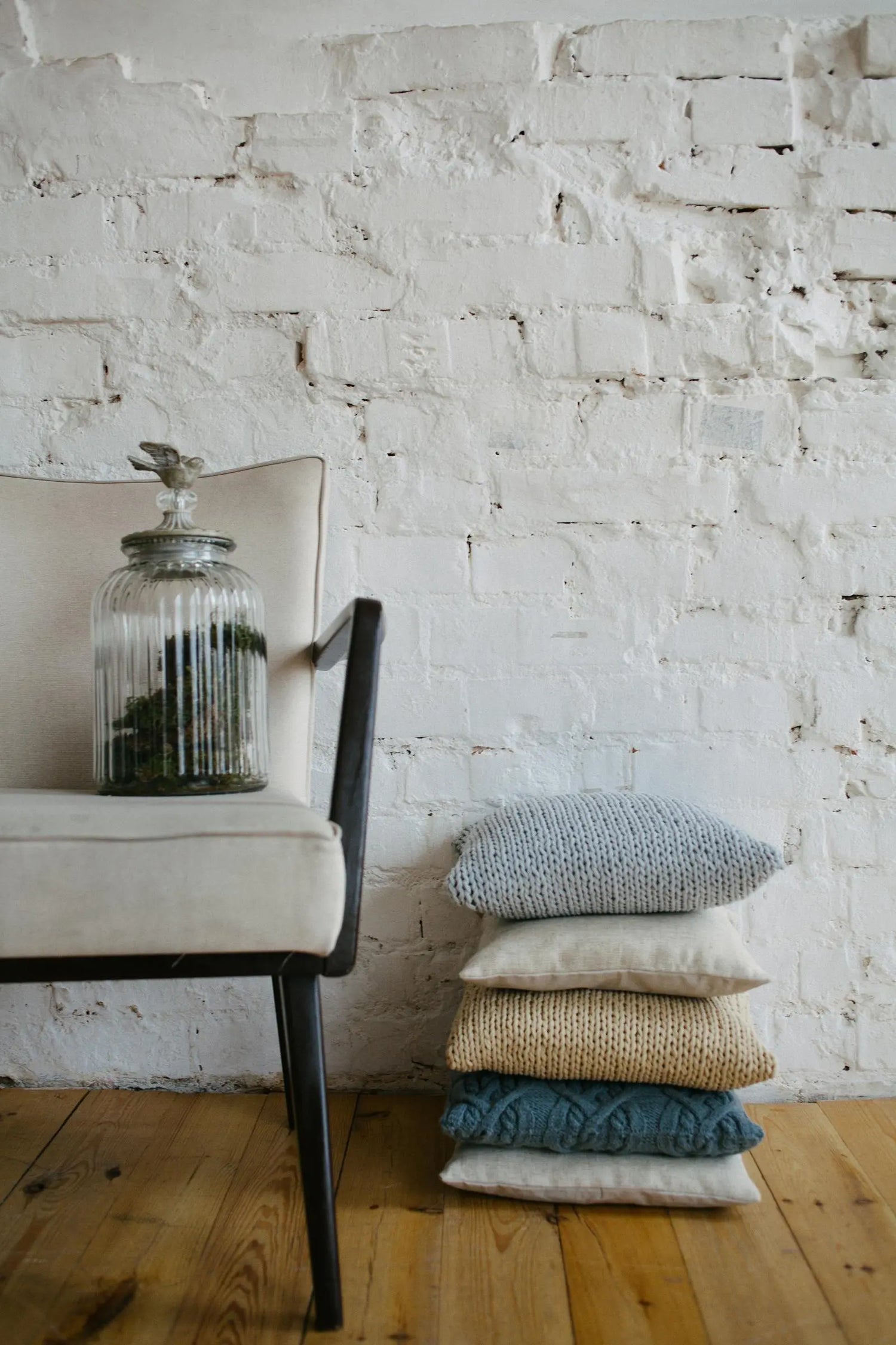 Cushions on a chair in a warm home setting