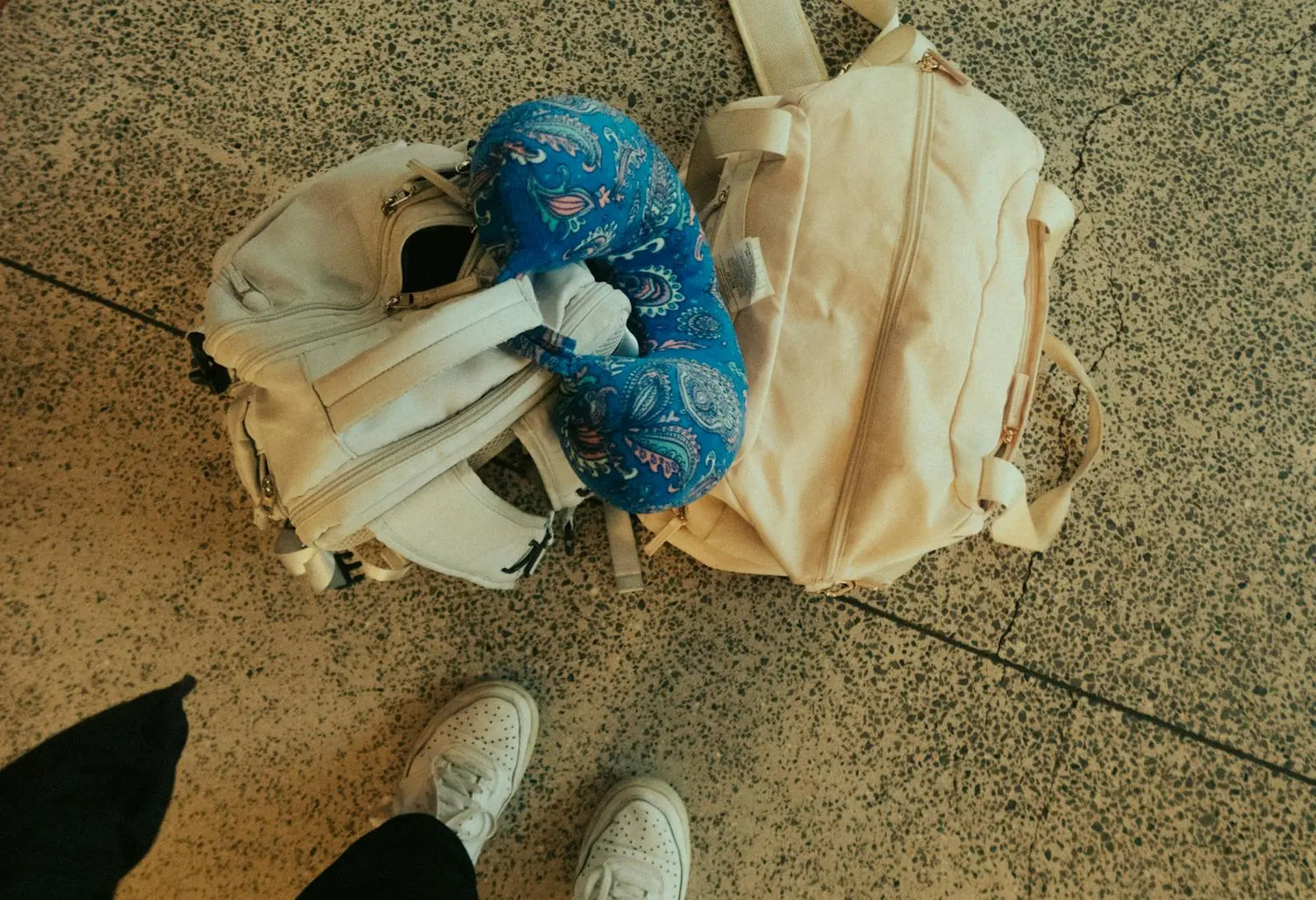 Travel bag with neck pillow ready for a trip