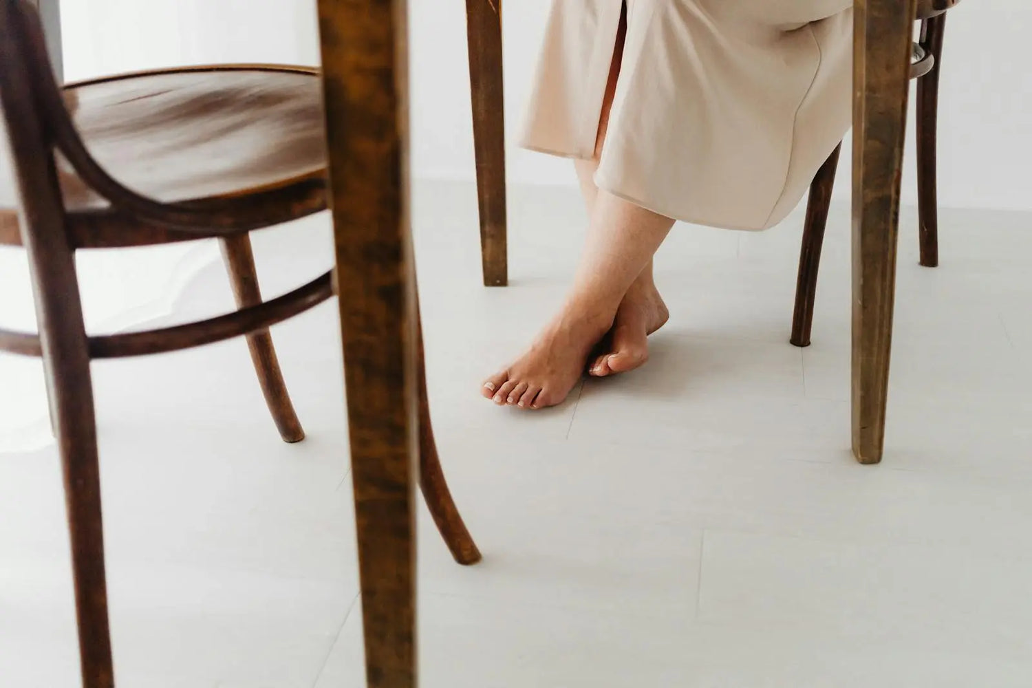 Feet resting comfortably under a table