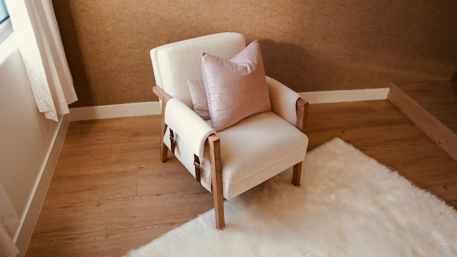 Comfortable armchair with soft cushions in a calm living space